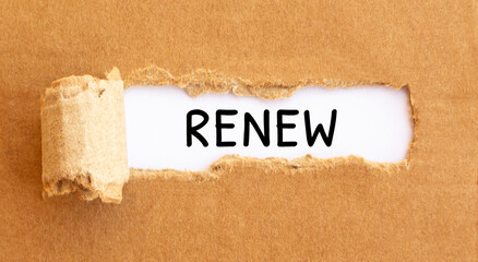 Text Renew appearing behind torn brown paper
