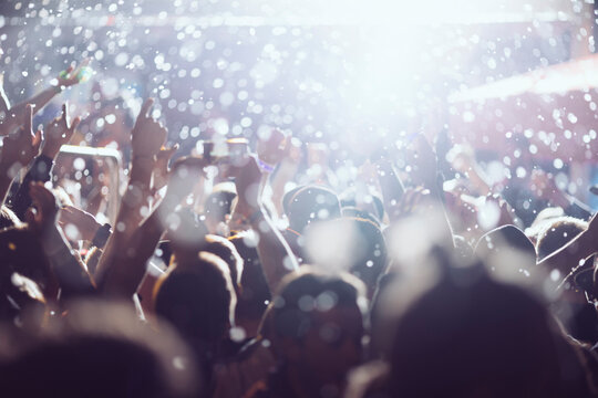Dancing crowd at live concert, festival