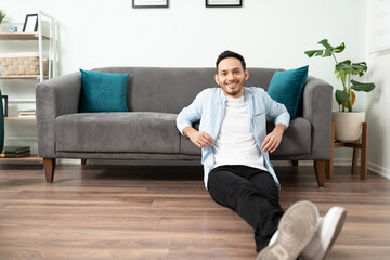 Happy guy relaxing in his apartment