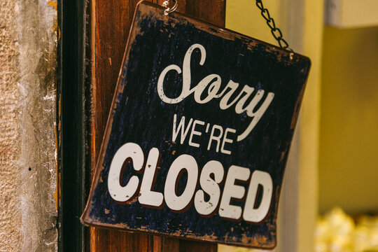 Sorry We are Closed Sign on a Shop Entrance