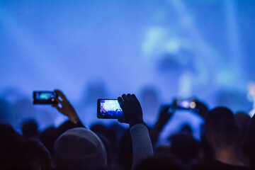 audience with mobile phones,performance,blue