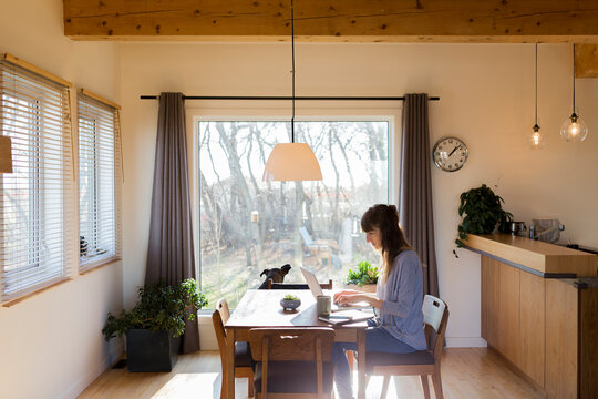 Woman working from modern home office