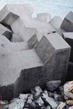 A pile of manmade barriers on a seashore