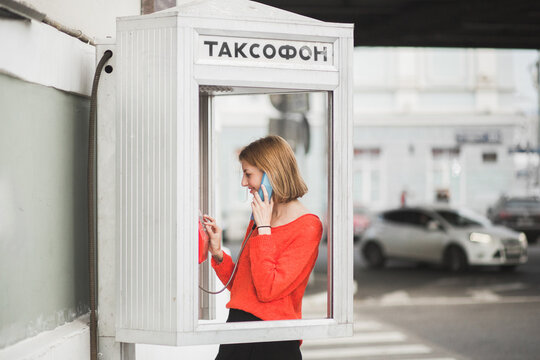 Girl in a telephone booth