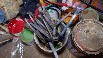 a selective focus image, Wayang golek, in the form of a wooden carved puppet with various characters. Photographed in low light and noise image.