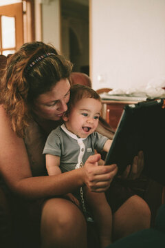 Mother and Son enjoying using a tablet