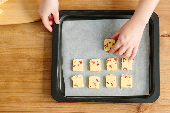 Young Chinese woman baking cookies