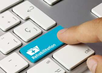 Rehabilitation - Inscription on Blue Keyboard Key.