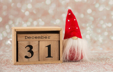 christmas card, leprechaun with wood calendar 31 december, new year's eve