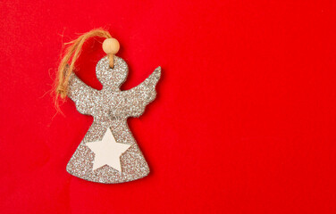 christmas angel silver on red background