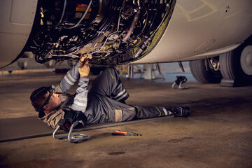 Repair and maintenance of aircraft engine on the wing of the aircraft © Svitlana