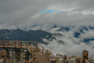 Obraz premium The mountain landscape with clouds around in Dagu glacier park in Sichuan, China.