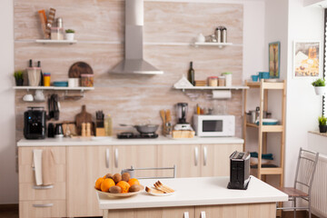 Fototapeta na wymiar Modern kitchen design with nobody in it - Bread toaster in kitchen with nobody in it. Modern kitchen coffee machine. Modern cozy interior with technology and furniture, decoration and architercture