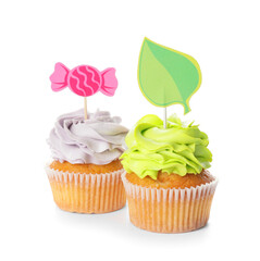 Tasty cupcakes with stylish toppers on white background
