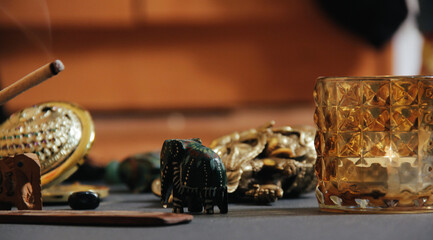 Table with occult attributes, top view. Stone rosaries, candles, aroma stick. Close-up, empty copy space