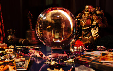 Beautiful crystal orb in a fortune teller's room. Glass ball. Occult symbol