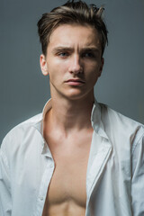 Fototapeta premium Fashion young man. Handsome guy with confident face.