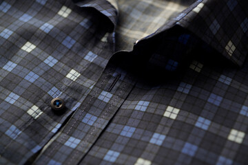 Close up of Men's checkered shirt.	