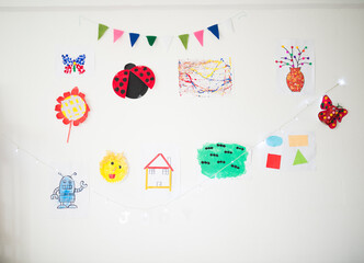 Child's artworks on the wall