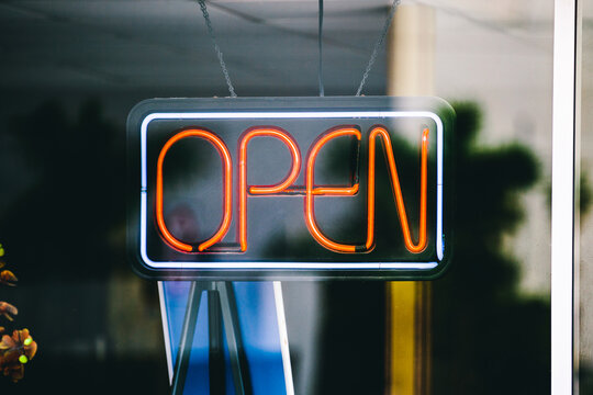 Open sign on a street shop window