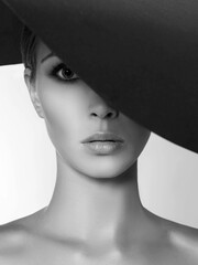 Beautiful woman in hat. black and white