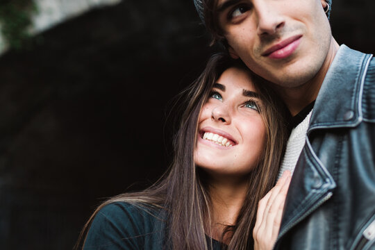 Young smiling woman looking at her boyfriend