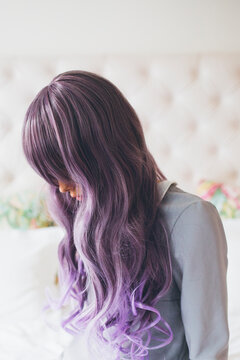 Fashionable young woman with purple hair portrait