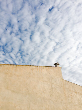 A small chimney on a sloping roof