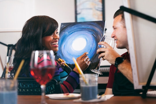 Painting: Woman And Friend Laughing During Painting Party