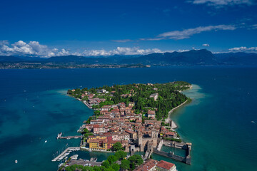 Aerial view at high altitude on Sirmione sul Garda. Italy, Lombardy.Rocca Scaligera Castle in Sirmione.