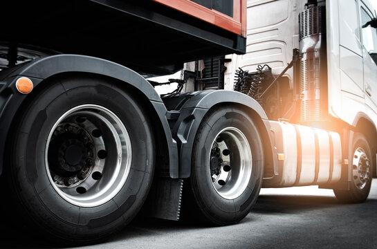 Large a truck wheels of semi truck. Road freight cargo. Logistics and transportation.