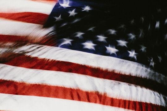 American flag waving in wind, long exposure