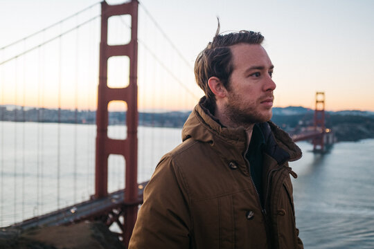 portrait of young male in front of golden gate bridge
