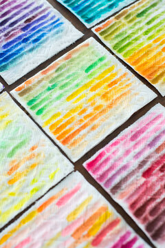 Colorful paper towel rags, used to clean off a paintbrush