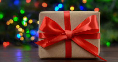 Christmas gift on a shimmering bokeh background