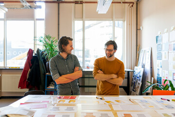 Two designers or creative professionals working in their studio or workplace