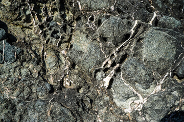 Colorful rock texture. Natural cracks void.