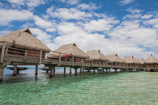 Row of over water bungalows in Tahiti.