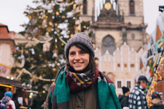 Beautiful happy woman in the city center during Christmas time