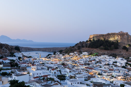 Elevated night view of Lindos and the acropolis on the Greek island of Rhodes