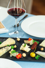 Assorted spanish cheese platter with red wine