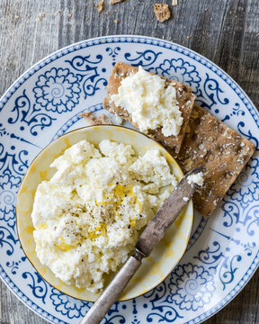 Close-up of homemade ricotta cheese and toasts
