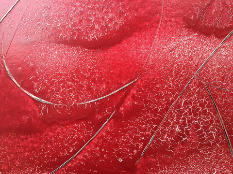 Close up painted red wall and markings