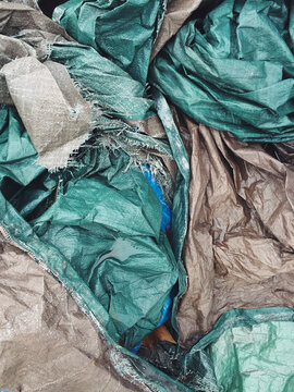 Pile of discarded industrial tarps
