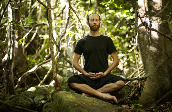 Man Practicing Zen Meditation in the Jungle