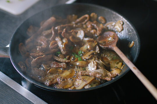 Cooking mushrooms in a pan