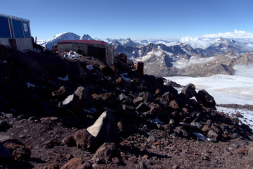 View from the slope of Elbrus from the upper shelter to the mountains around. Shelter on the slope of Elbrus. 