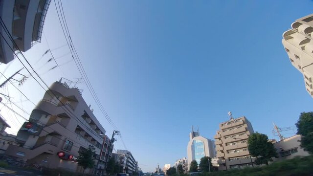 A moving cityscape at the downtown at Kanpachi avenue in Tokyo by low angle