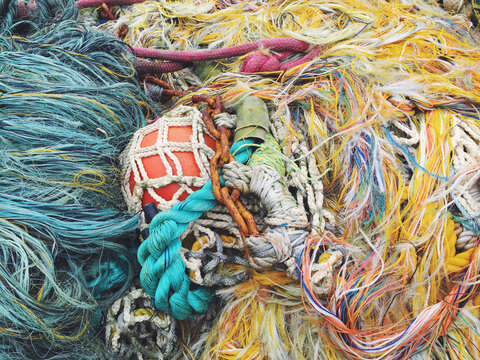 Close up of piles of commercial fishing nets and ropes