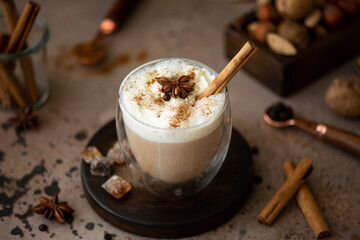 caffe latte with whipped cream, cinnamon and anise
